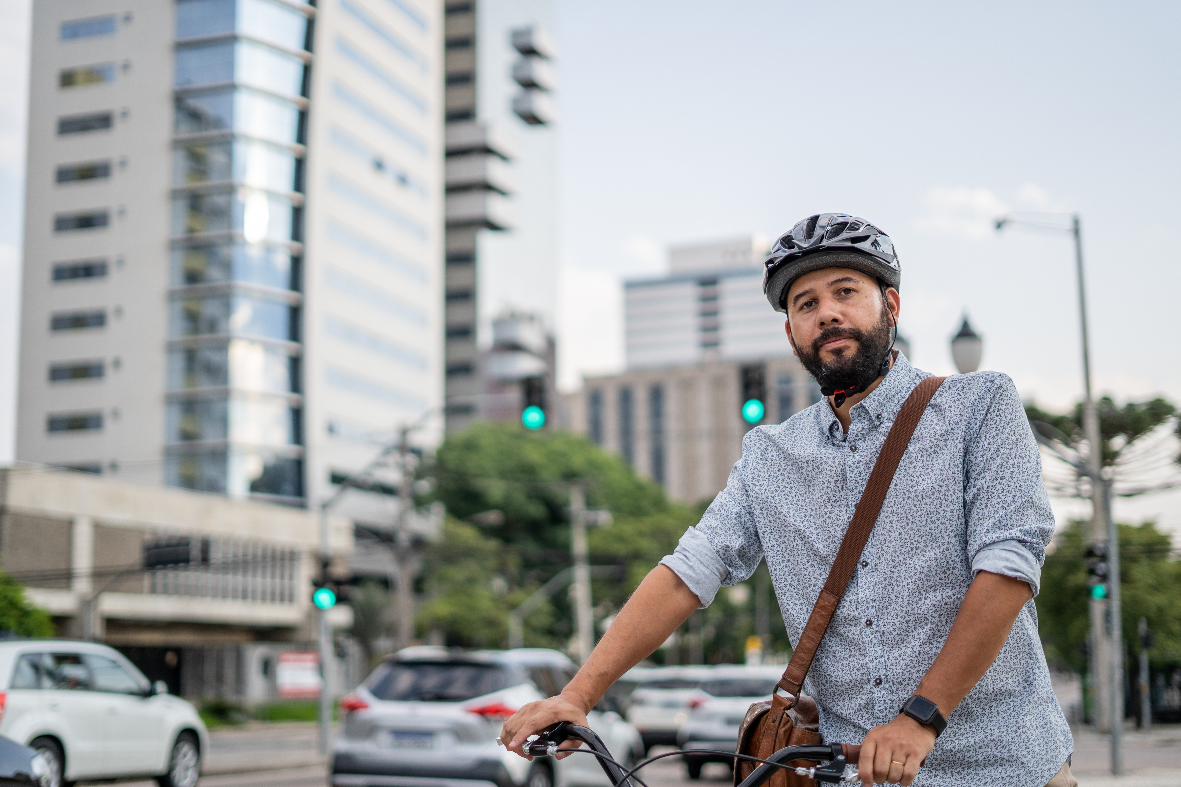 Portrait of man returning from work by bicycle